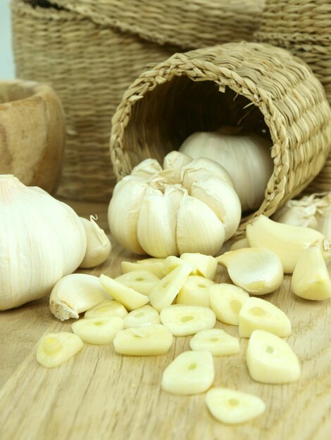 Garlic and garlic on a table with a basket