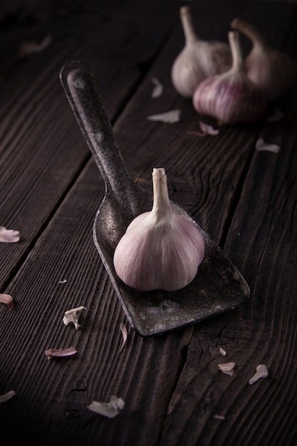 Garlic heads on a wooden table, natural organic food. 