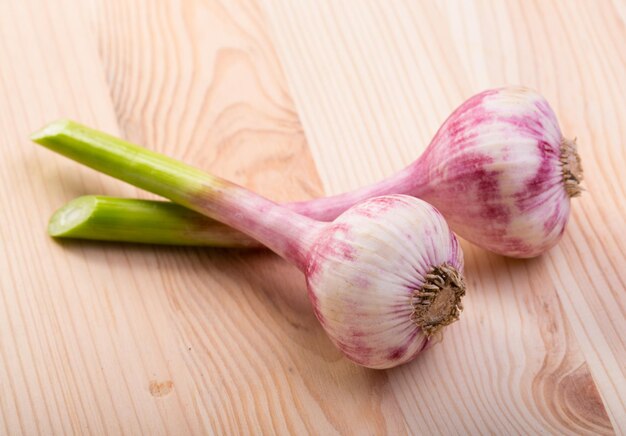 Garlic lying on a wooden table