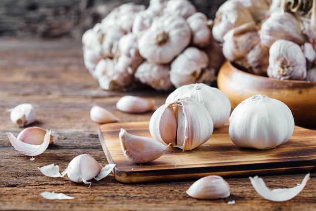 garlic on old wooden table background