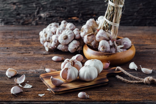 garlic on old wooden table background