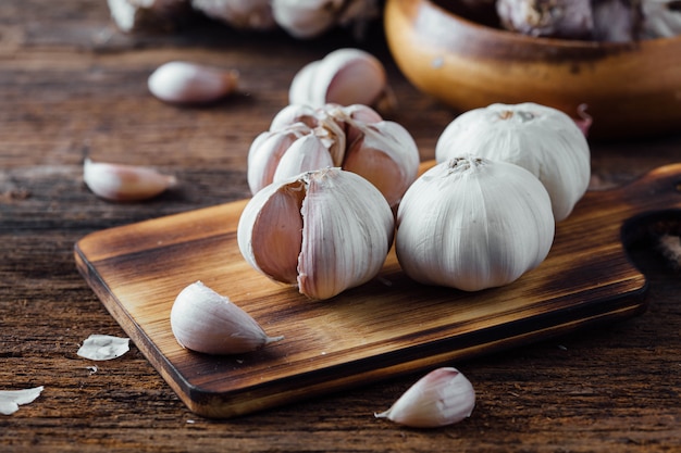 garlic on old wooden table background