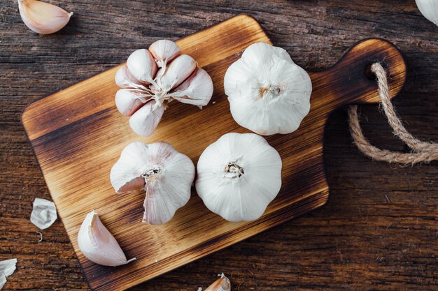 garlic on old wooden table background