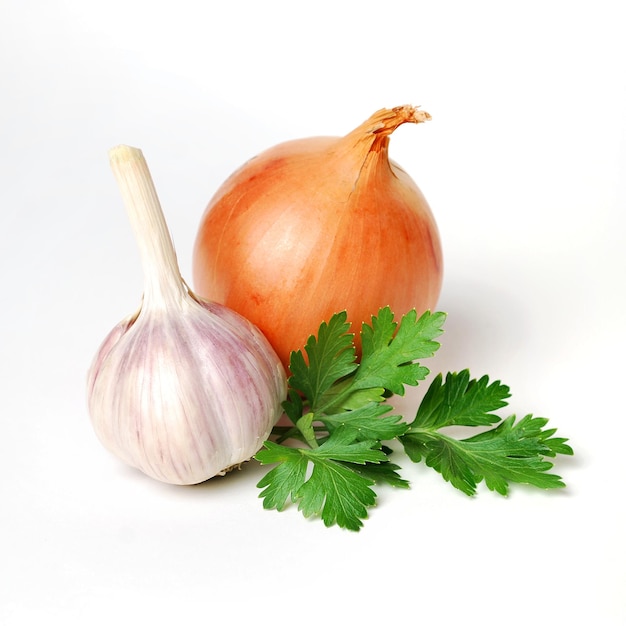 Garlic parsley and onion isolated on white background