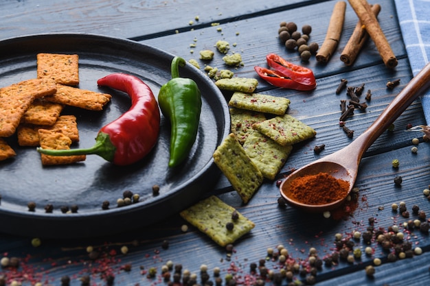 Garlic pepper paprika on a wooden spoon and spices