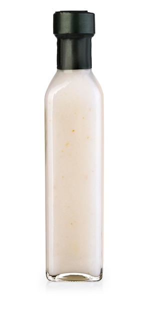 Фото Чесночный соус в бутылке на белом фоне