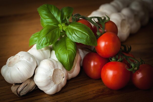 Garlic tomatoes and basil on the table