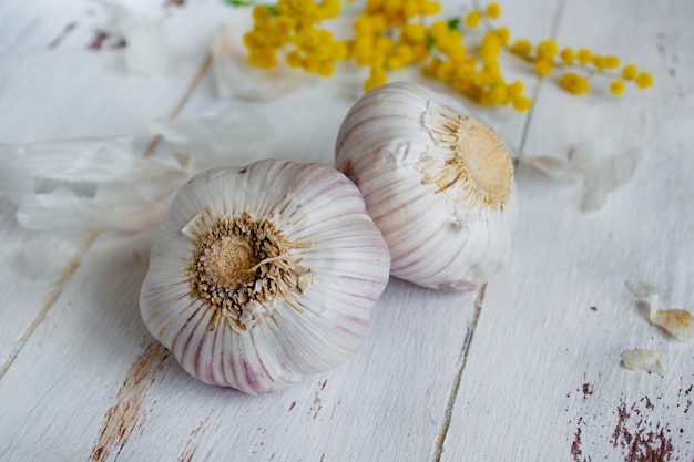 Garlic on a white wood.  