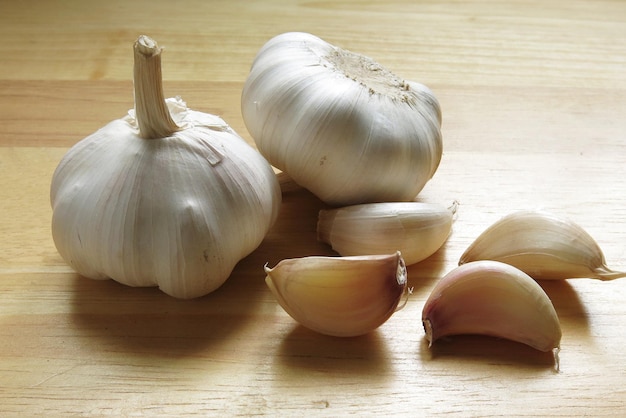 Garlic Whole Cloves On Wooden Background