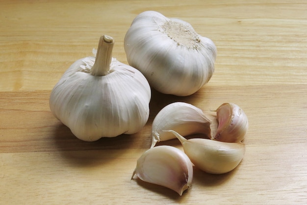 Garlic Whole Cloves On Wooden Background             