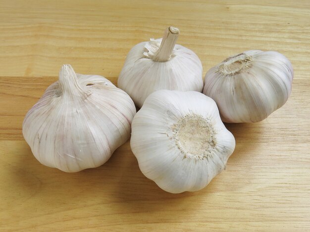 Garlic Whole Cloves On Wooden Background   