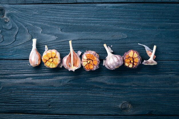 Garlic On a wooden background Top view Free space for your text