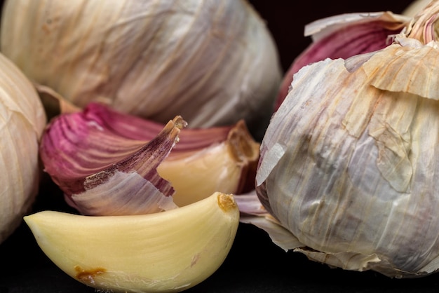 Garlics on black background. Food.