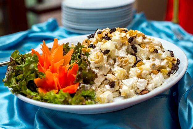 Garnish with chicken and pineapple on a plate