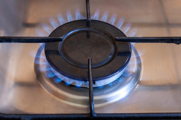 Gas burner with blue flame closeup