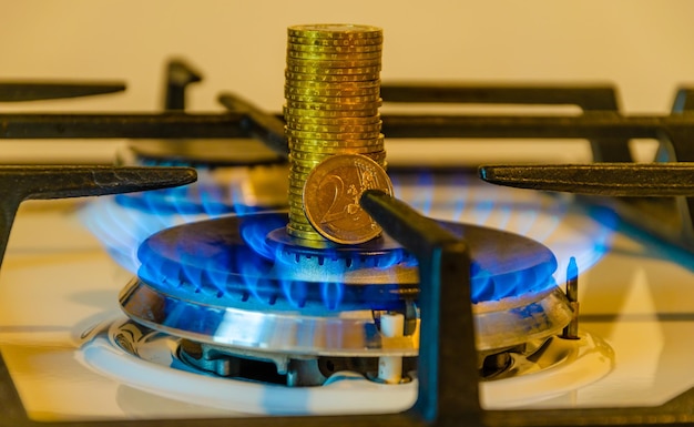 Photo a gas burner with a coin on top of it