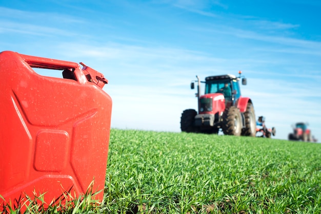 Gas can and tractor in the field