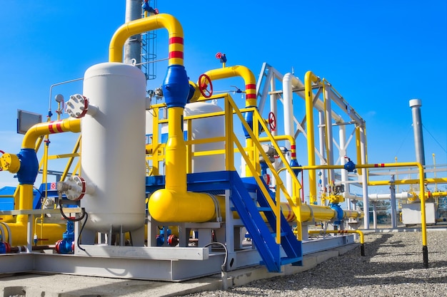 Photo gas distribution station industrial facility gas processing station with yellow pipes on a summer