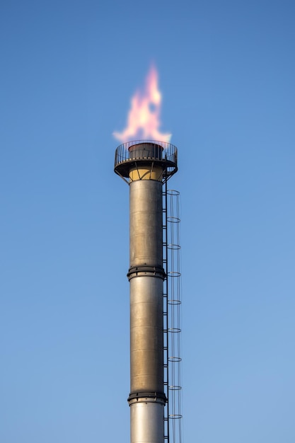 Photo gas extraction chimney burning high up