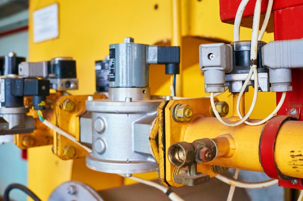 Gas pressure regulator in the conduit colored yellow.                           