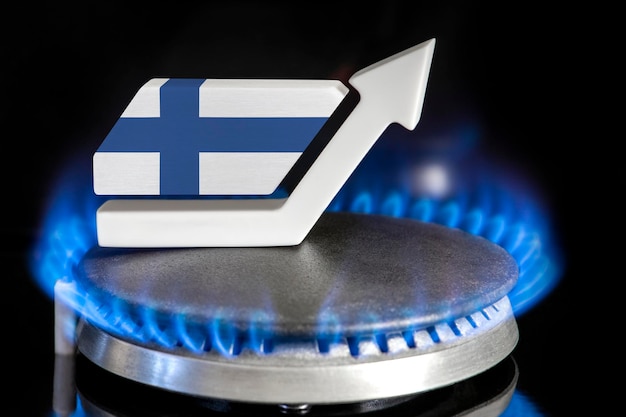 Gas price Rise in gas prices in Finland A burner with a flame and an arrow up painted in the colors of the Finland flag The concept of rising gas or energy prices