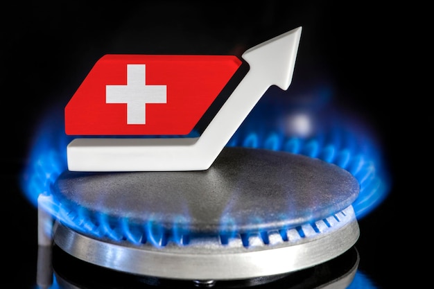 Aumento del prezzo del gas dei prezzi del gas in svizzera un bruciatore con una fiamma e una freccia in alto dipinta nel col