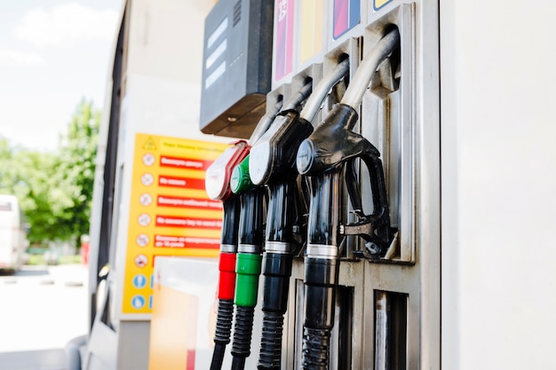 Photo gas pump nozzles in a service station