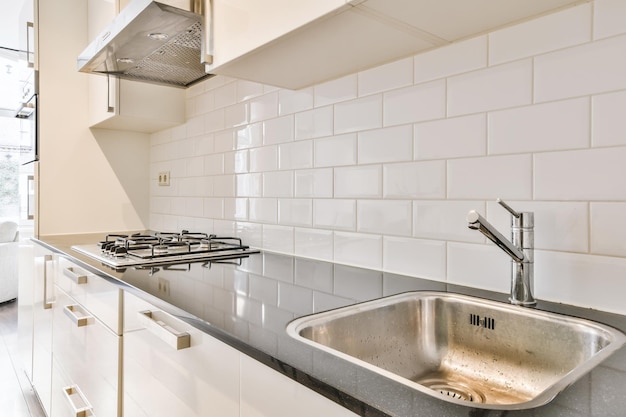 Gas stove and sink built into the black countertop