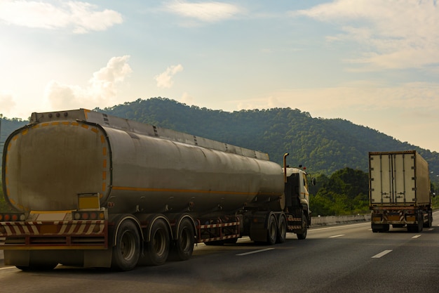 Gas Truck on highway road with tank oil container
