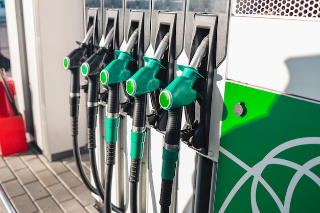 Gasoline and diesel distributor at the gas station. Gas pump nozzles.