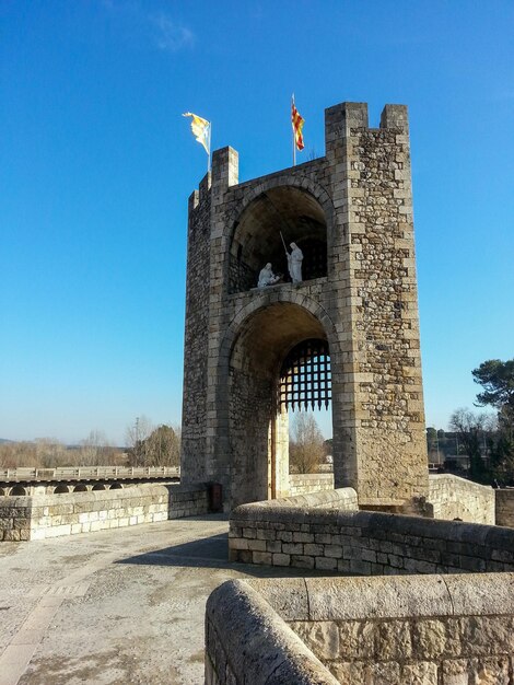 Gate in a roman bridge at the entrance of town