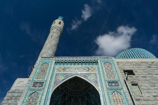 The gate and the tower of a blue mosque