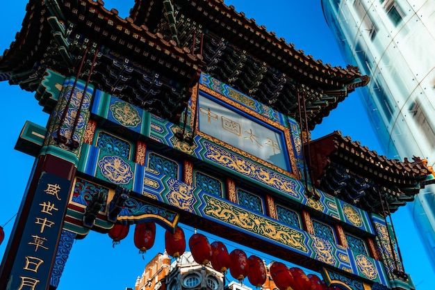 Gate way to chinatown street market in london united kingdom with lots of street food