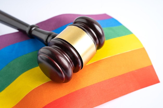 Gavel for judge lawyer on rainbow flag symbol of LGBT pride month celebrate annual in June social of gay lesbian bisexual transgender human rights