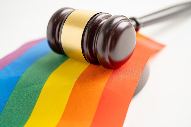 Gavel for judge lawyer on rainbow flag symbol of LGBT pride month celebrate annual in June social of gay lesbian bisexual transgender human rights