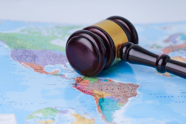 Gavel for judge on wold globe map