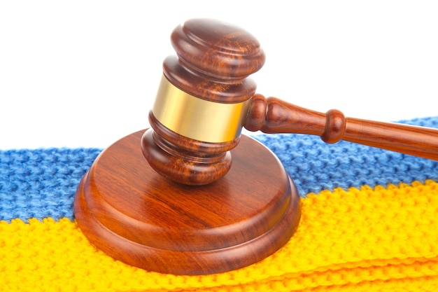 Gavel of justice on the background of the Ukrainian flag