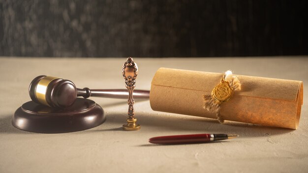 Gavel notary\'s public pen and stamp on testament and last will.\
notary public tools