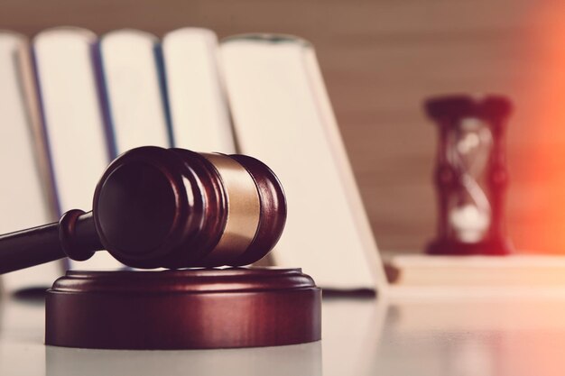 Gavel and stethoscope on wooden desk