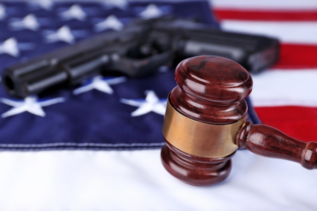 Gavel with gun on background of USA flag