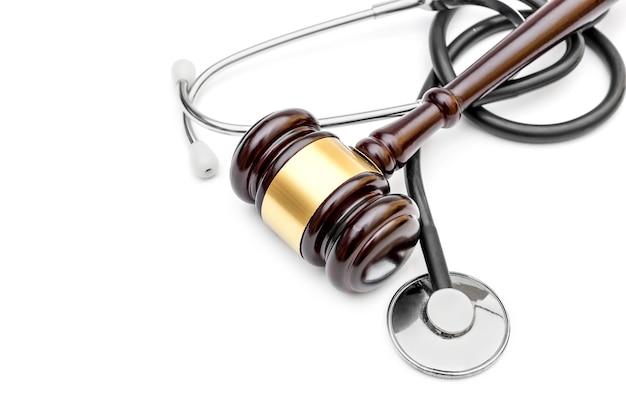 Photo gavel with stethoscope on white top view copy space medical law