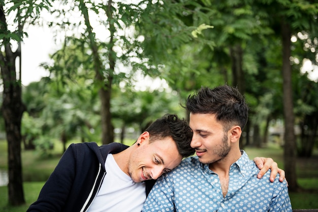 Gay couple dating in a park