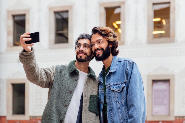 Gay couple taking a selfie with a mobile phone