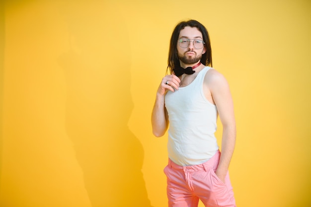 Gay man on a colored background in the studio the concept of the lgbtq community equality