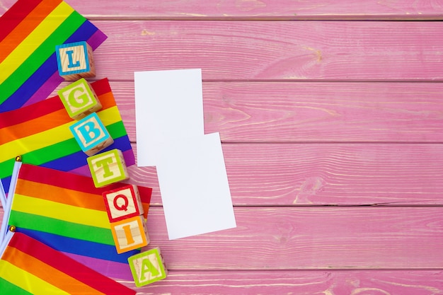 Gay pride flag on wooden table