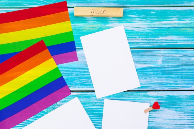 Gay pride flag on wooden table