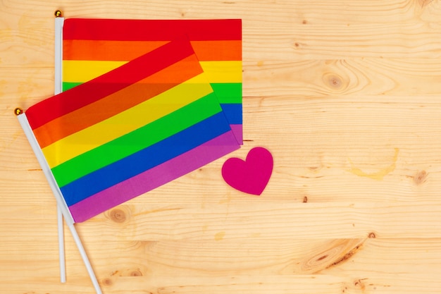 Gay pride flag on wooden table