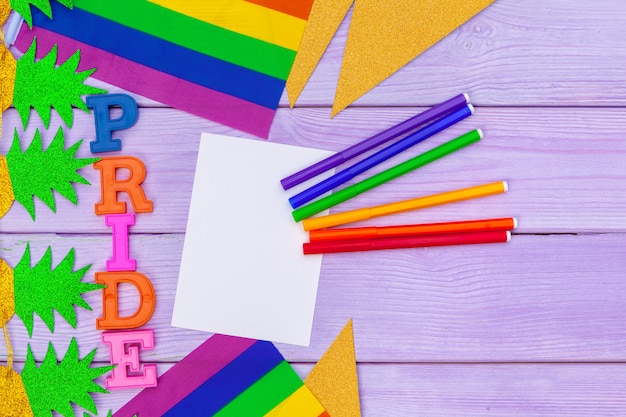 Gay pride flag on wooden table