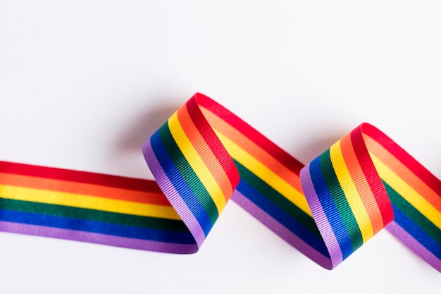 Gay pride LGBT rainbow ribbon on white background