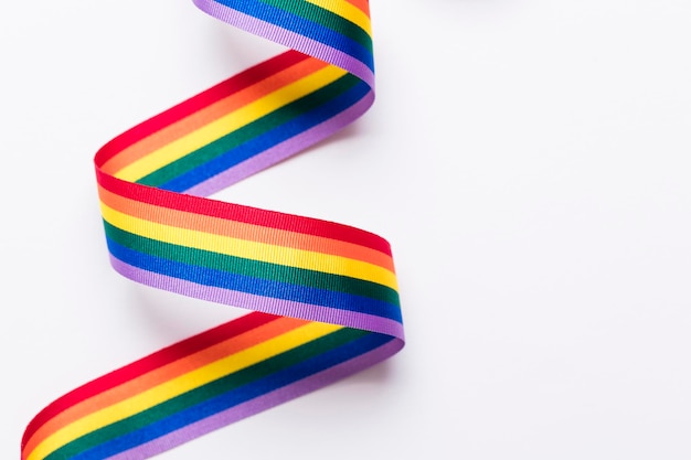 Gay pride LGBT rainbow ribbon on white background